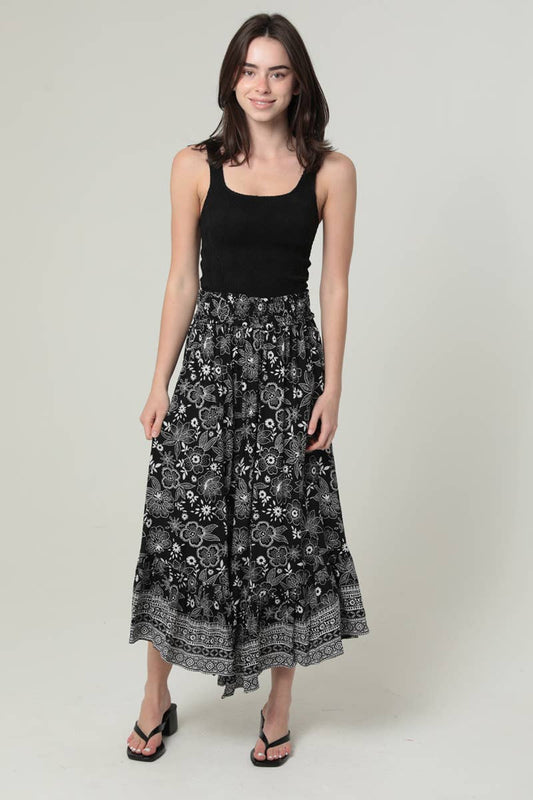 26P93-FR17 PRINTED ANGLED HEM MAXI SKIRT WITH SMOCKED WAIST